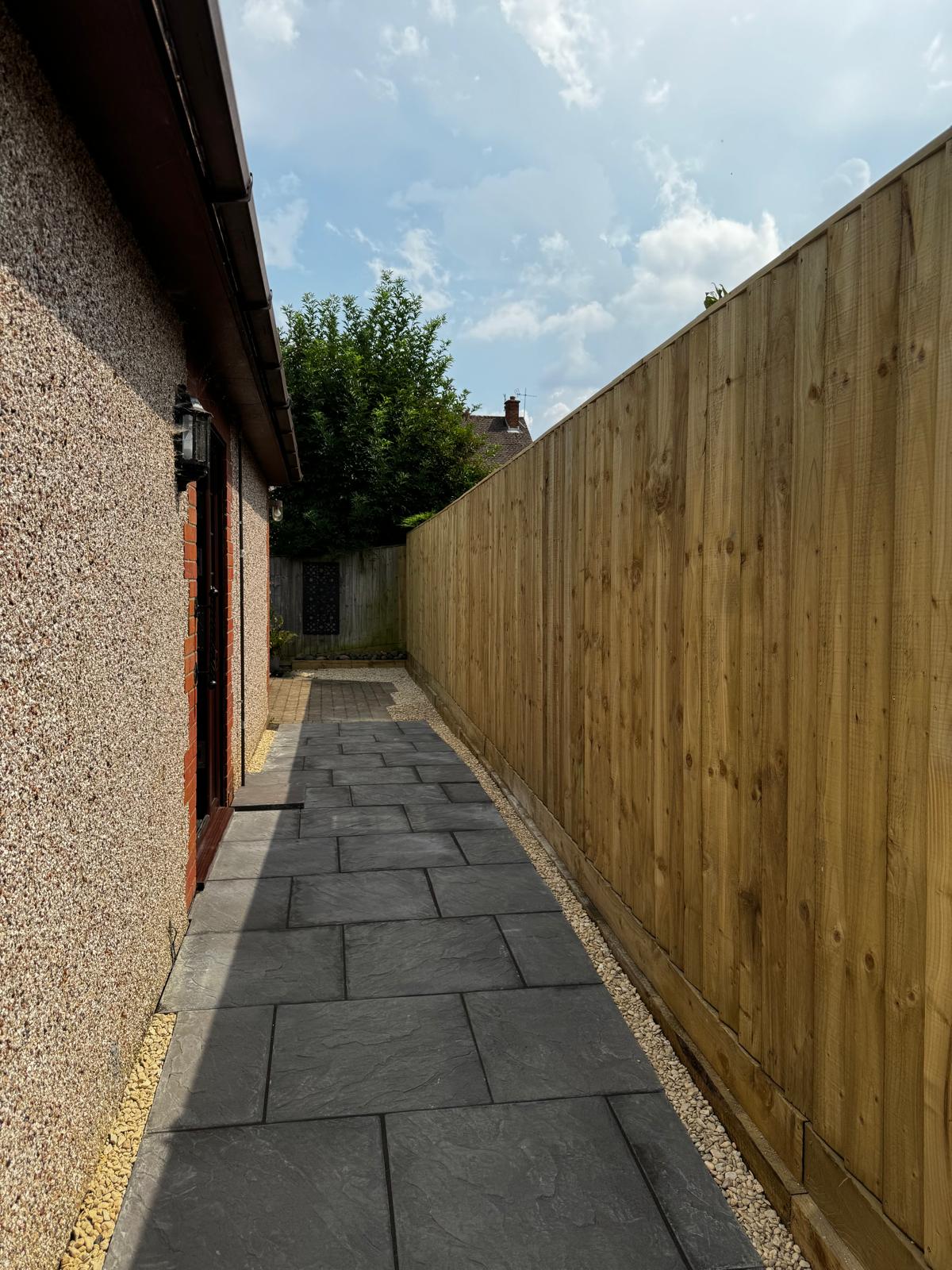 Slate paving pathway with gravel borders
